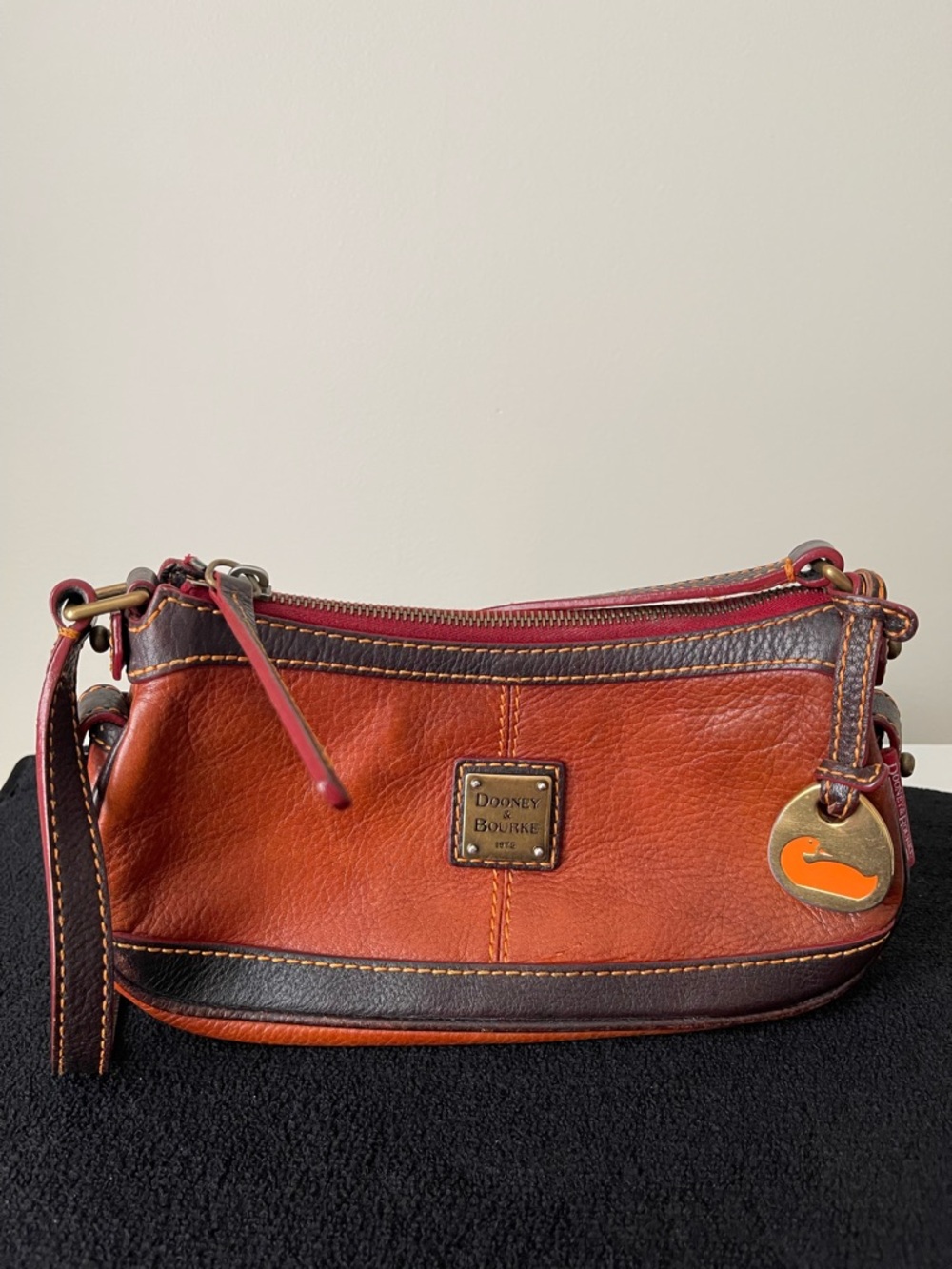 Dooney & Bourke Orange and Brown Leather Wristlet